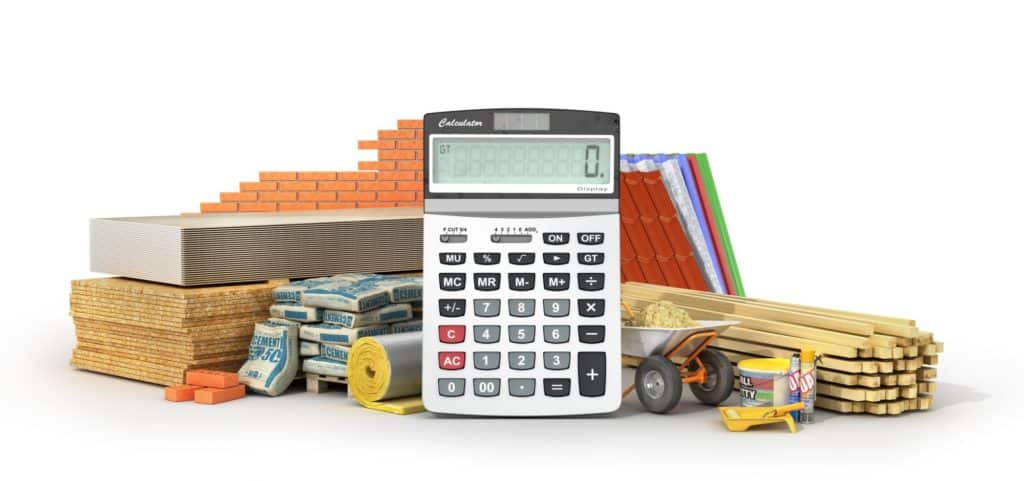 "Construction Financial Management concept featuring a calculator surrounded by building materials, including bricks, wooden planks, cement bags, insulation rolls, and construction tools."