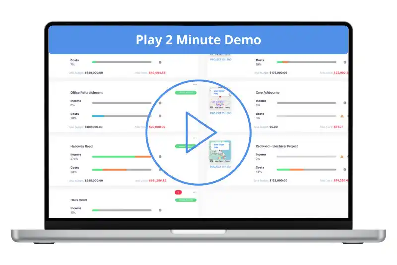 Laptop screen displaying a construction job costing software dashboard, featuring multiple real-time project budget overviews with income and cost progress bars, including projects like Office Refurbishment and Hallway Road; a blue banner across the top reads “Play 2 Minute Demo” with a large central play button inviting users to view a short demonstration.